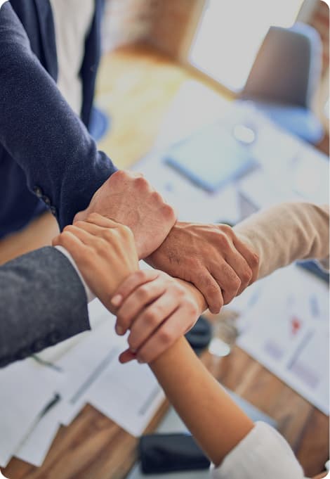 Team putting hands together in collaboration